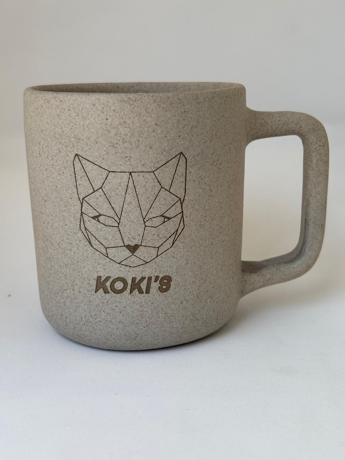 Engraved stoneware mug with the Koki's mark